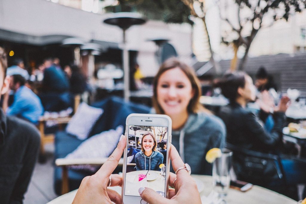 Lady smiling while her photograph is being taken - surrey web studio