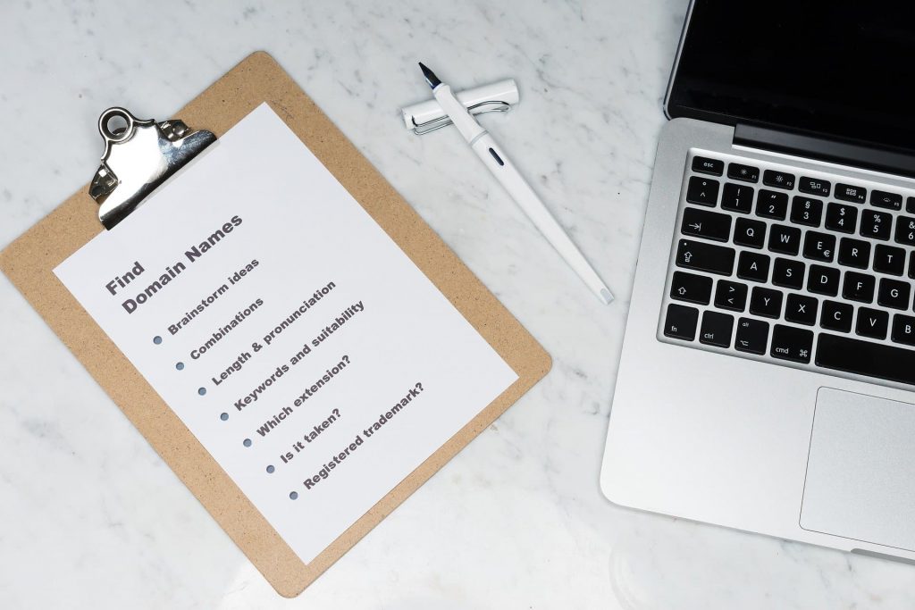 domain name notes on a clipboard